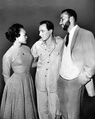 Gene Kelly with Eartha Kitt and Ike Jones on the set of "Brigadoon"
